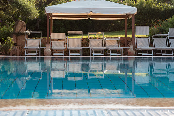 free-standing awning next to pool